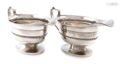 A pair of silver sauce boats, by Duncan & Scobbie, Birmingham 1936, oval form, scroll handle,