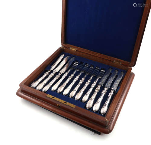 A set of twelve Victorian silver fruit knives and forks, by Joseph Rodgers & Sons, Sheffield 1864,