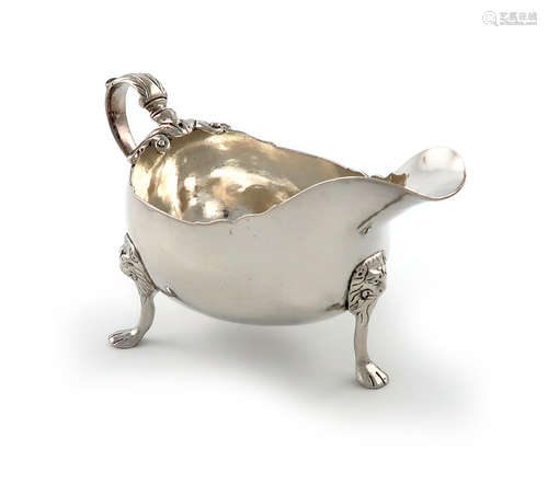 A George III Irish silver sauce boat, maker's mark ?W, Dublin circa 1770, oval form, wavy-edge