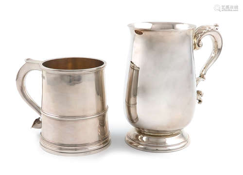 A modern silver mug, by Elkington and Co., Birmingham 1963, baluster form, leaf capped scroll