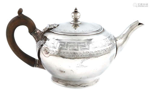 A George III silver tea pot, by Thomas Law, Sheffield 1802, circular form, with an engraved Greek