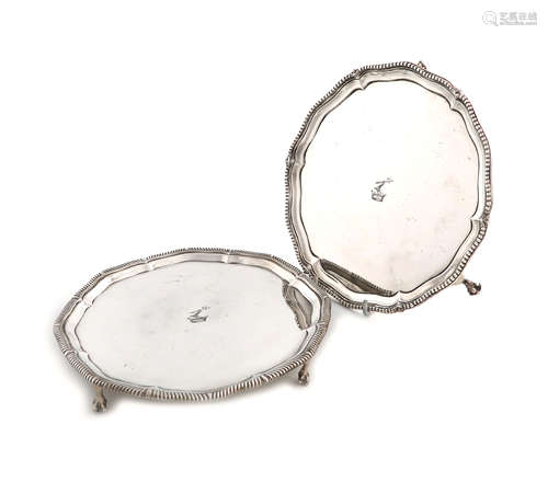 A George III silver waiter and a later similar silver waiter, by Stephen Adams, London 1819, and The