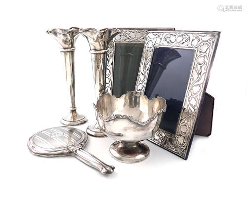 A mixed lot of silver items, comprising: a pair of trumpet vases, by Walker and Hall, Sheffield