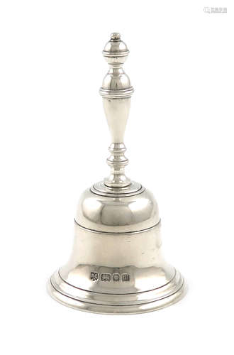 A silver table bell, by R. Comyns, London 1927, plain form, baluster handle, height 10.5cm,