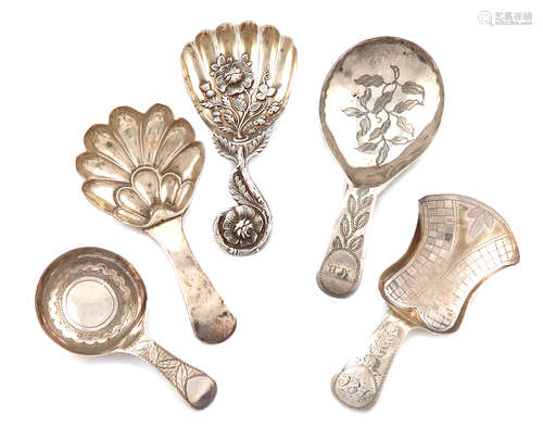 A collection of five antique silver caddy spoons, various dates and makers, including: a Victorian