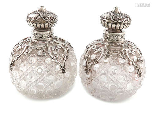 A pair of Victorian silver-mounted cut-glass scent bottles, by J. Rosenthal, London 1892, globular