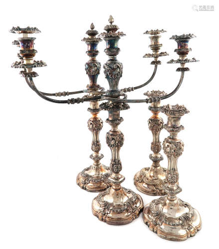 A set of four early 19th century old Sheffield plated candlesticks with two pairs of three light