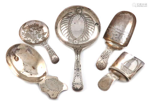 A collection of five antique silver caddy spoons, various dates and makers, including: a George