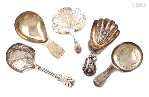 A collection of five antique silver caddy spoons, various dates and makers, including: a George