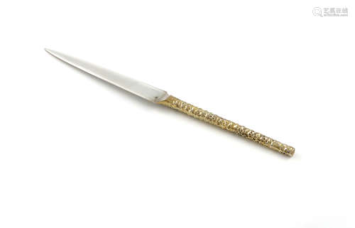 By Stuart Devlin, a modern parcel-gilt silver letter opener, London 1985, tapering form, with a