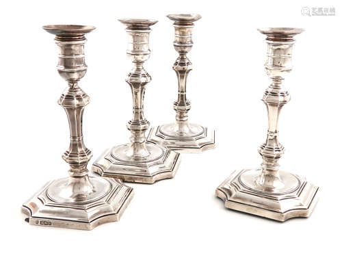 A set of four late-Victorian silver candlesticks, by Hawksworth, Eyre and Company, Sheffield 1899,