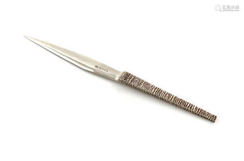 By Stuart Devlin, a modern silver letter opener, London 1977, tapering form, with a tapering