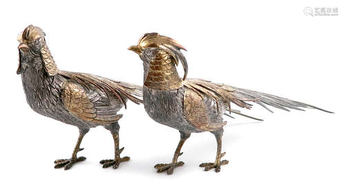 A pair of modern Spanish parcel-gilt silver pheasants, modelled in standing positions, textured