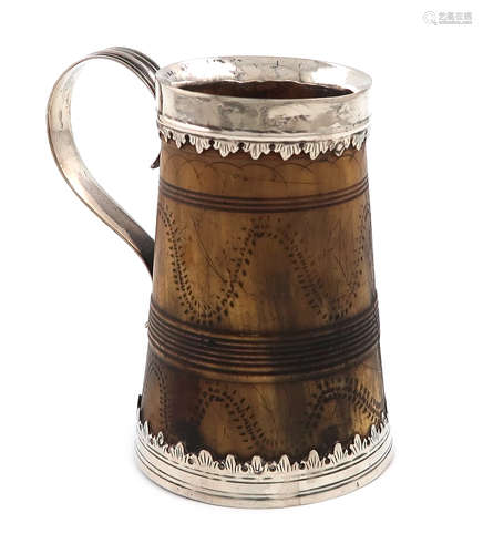 A Charles II silver-mounted horn mug, unmarked, circa 1680, tapering circular form, reeded scroll