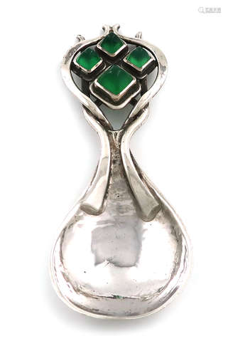 By Omar Ramsden, an Arts and Crafts silver caddy spoon, London 1927, spot-hammered fig-shaped