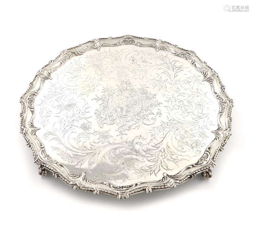 A George III silver salver, by Richard Rugg, London 1768, circular form, bead and scroll border, the