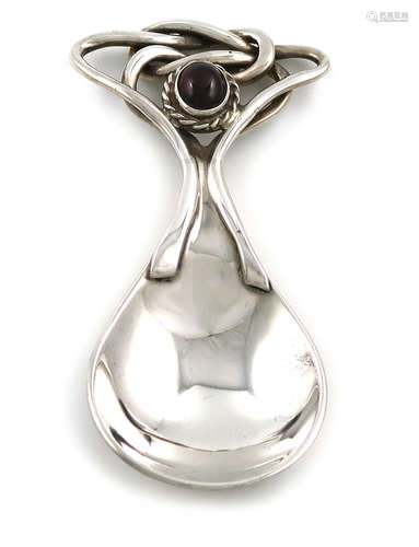 A modern silver caddy spoon in the Omar Ramsden manner, by RB ltd, London 2005, spot hammered fig