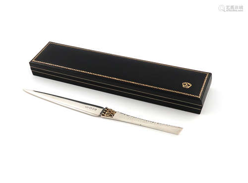 By Stuart Devlin, a modern parcel-gilt silver letter opener, London 1982, tapering form, with a