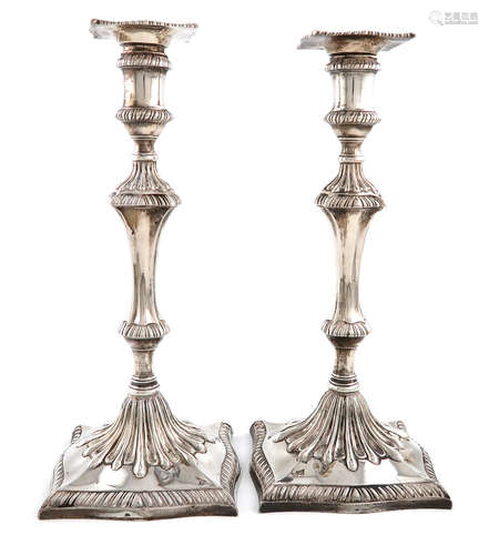 A pair of George III silver candlesticks, probably by John Carter, London 1770, the bases also