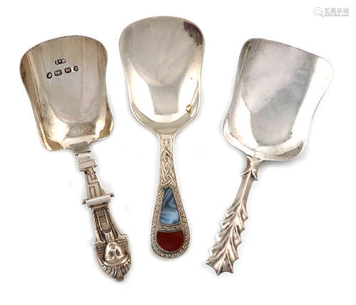 A small collection of three silver caddy spoons, comprising: a Victorian one, by Hilliard and