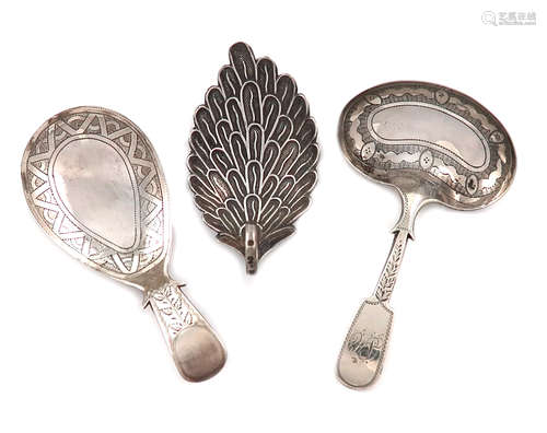 A small collection of three antique silver caddy spoons, comprising: one by Cocks and Bettridge,