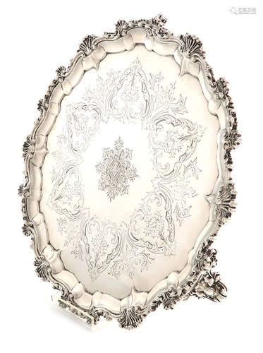 λA Victorian silver salver, by Frederick Elkington, London 1878, circular form, foliate and shell