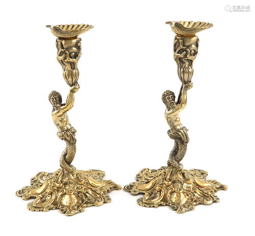 A pair of George IV cast silver-gilt candlesticks, by Sebastian Crespell II, London 1824, the