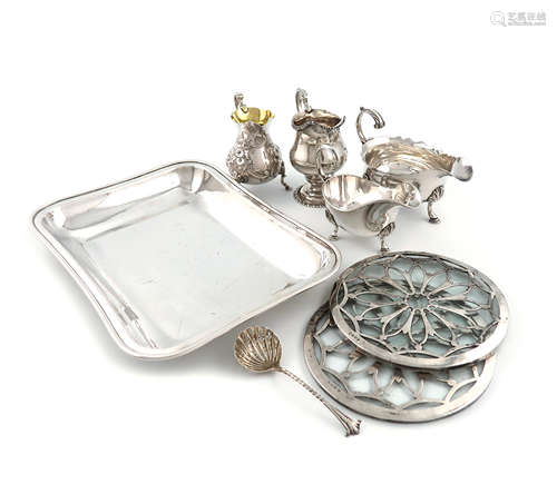 A mixed lot of silver items, various dates and makers, comprising: a George III sauce boat, maker'