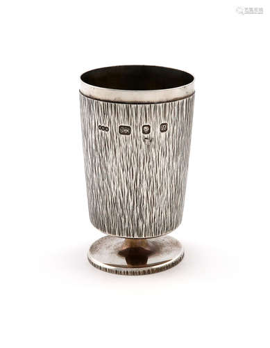 By Gerald Benney, a modern silver goblet, London 1968, textured decoration, plain rim, on a raised