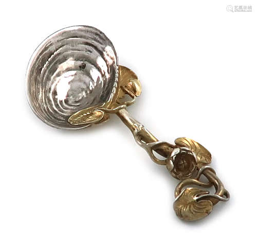 A Victorian parcel-gilt cast silver caddy spoon, by Francis Higgins, London 1852, shell bowl, with a