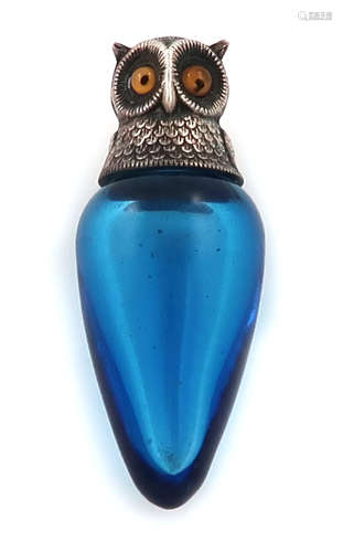 A Victorian novelty silver-mounted owl scent bottle, by S. Mordan and Co, London 1894, tapering blue