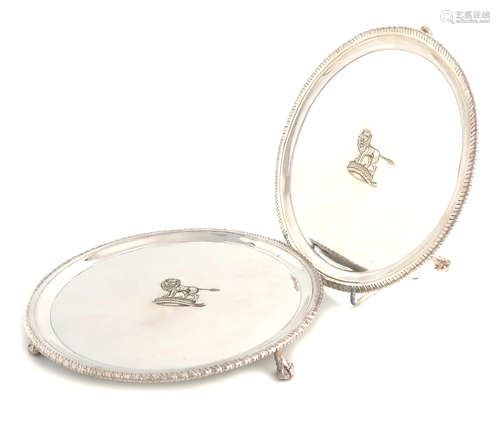 A pair of George III silver waiters, by John Carter, London 1775, circular form, gadroon borders,