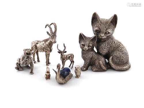 A mixed lot of silver animals, comprising: a model of a lion, London 1982, a sable antelope, and