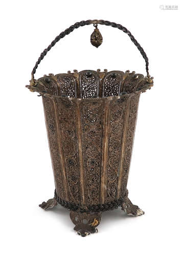 A metalware filigree basket, unmarked, tapering circular form, with niello stud decoration, scroll