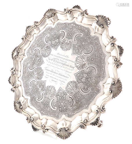 A George III silver salver, maker's mark T.P, London 1780, circular form, shell and scroll border,