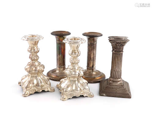 A mixed lot of silver candlesticks, comprising: an Edwardian pair, Birmingham 1904, circular form,