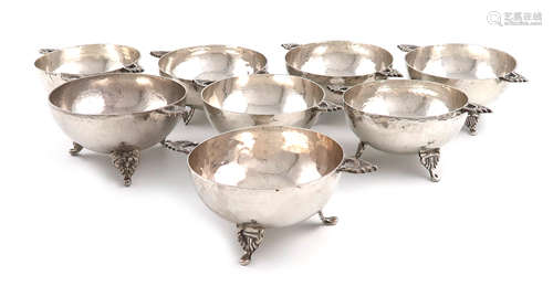 A matched set of eight two-handled metalware finger bowls, marked 0.900, circular form, pierced