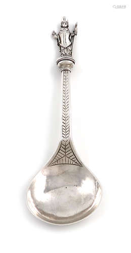 An Edwardian Arts and Crafts silver Apostle spoon, by Edmund Ware, London 1904, fig-shaped bowl, the