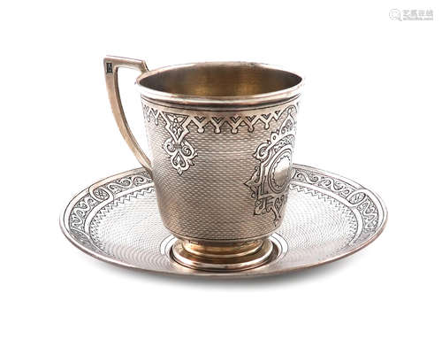 A 19th century Russian silver cup and saucer, assay master Viktor Savinkov, Moscow 1874, tapering