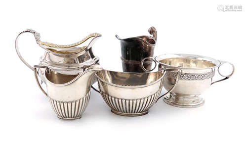 A mixed lot of silver items, various dates and makers, comprising: an Edwardian silver cream jug,