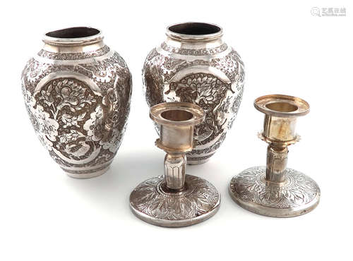 A pair of Persian metalware vases, baluster form, chased foliate decoration, height 12cm, plus a