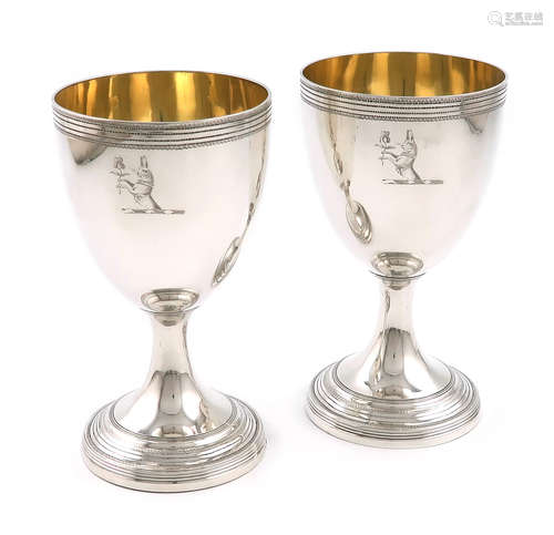 A pair of George III silver goblets, by Robert Hennell I, London 1794, urn shaped bowls, gilded