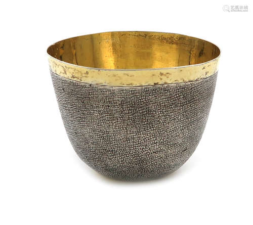 An unmarked, parcel-gilt silver tumbler cup, probably 18th century and German, tapering circular