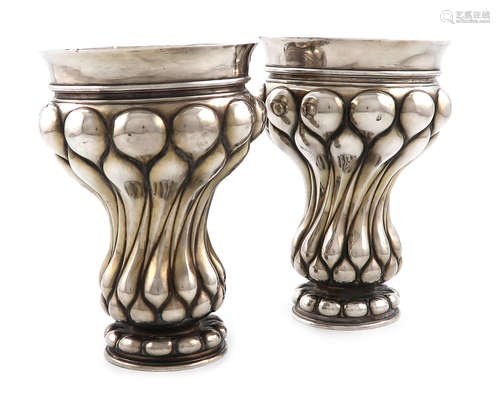 A pair of continental silver beakers, bearing pseudo 18th century Russian marks, tapering lobed