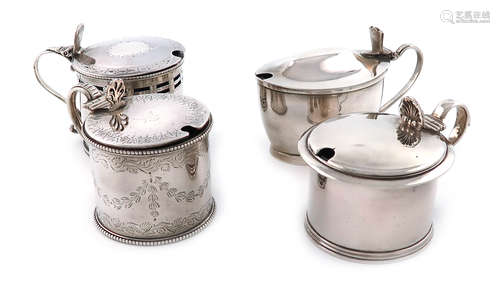 A collection of four antique silver mustard pots, comprising: a George III one of oval form, by