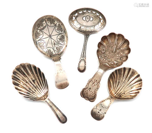 A collection of five antique silver caddy spoons, various dates and makers, including: a William