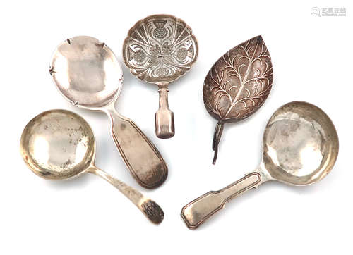 A collection of five antique silver caddy spoons, various dates and makers, including: a George