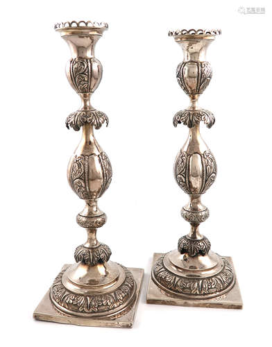 A pair of late 19th century Russian silver candlesticks, maker's mark possibly MK, Vilnus,