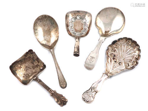 A collection of five antique silver caddy spoons, various dates and makers, including: a Victorian