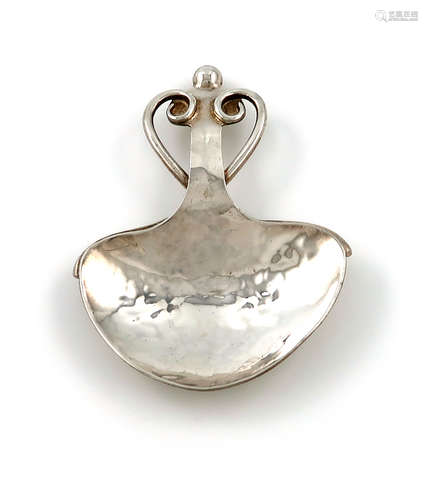 By A. E. Jones, an Arts and Crafts silver caddy spoon, Birmingham 1911, spread heart-shaped bowl,